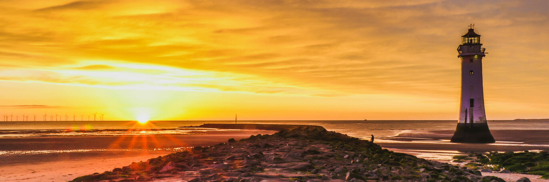 Lighthouses, Skylines, Photography and Fish n Chips  - Photo of Perch Rock Lighthouse in New Brighton with the sun setting behind